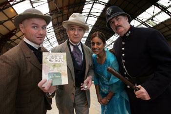 Richard Durnford as Passepartout, Simon Cook as Phileas Fogg, Manjit Sylvester-Jhali as Princess Aouda and Mike Rowland as Detective Fix